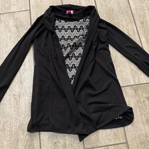 Fancy, glitter top with black sleeves attached.
